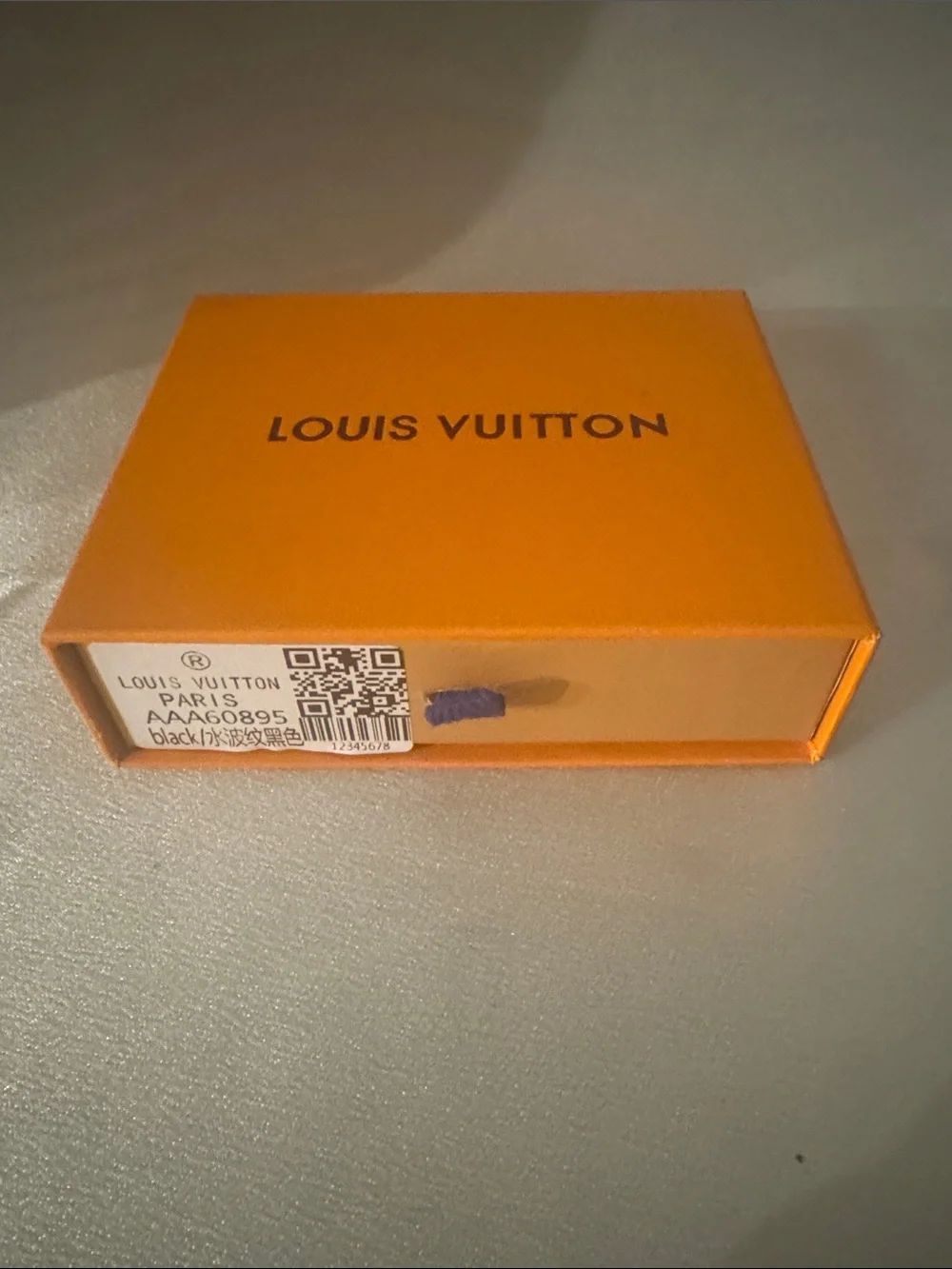 Louis Vuitton x Supreme Epi leather wallet featuring an embossed Supreme logo!